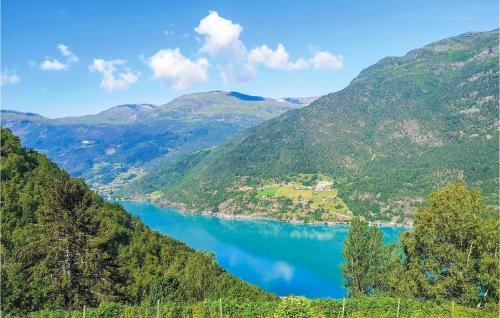a view of a lake between two mountains at 4 Bedroom Stunning Home In Skjolden in Luster