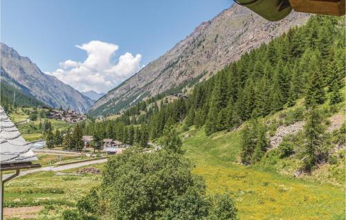 a view of a valley with a road and mountains at Valsavarenche in Maisonasse