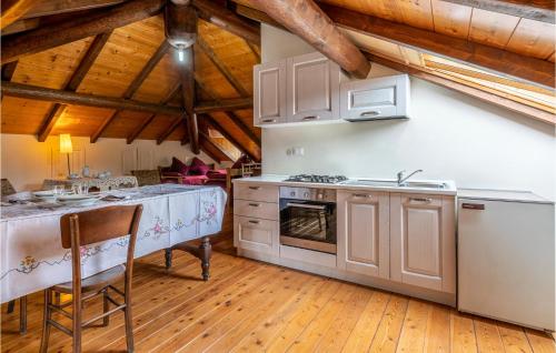 a kitchen with a sink and a stove top oven at Pet Friendly Apartment in Carchelli