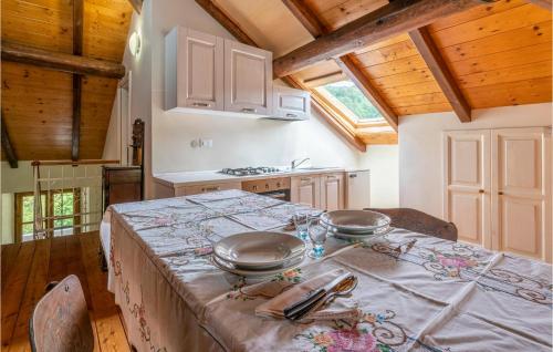 a kitchen with a table with two pans on it at Pet Friendly Apartment in Carchelli