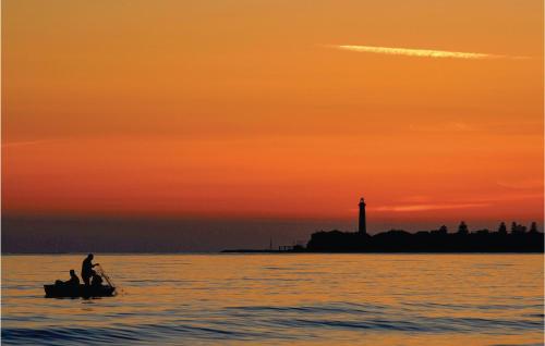 two people in a boat in the water at sunset at Casa Pirato in Modica