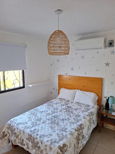 a bedroom with a bed with stars on the wall at Casa de las Dunas in Ciudad Madero