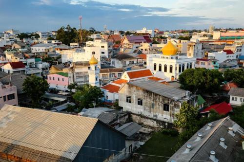 an aerial view of a city with buildings at Lake Inn Hotel in Songkhla