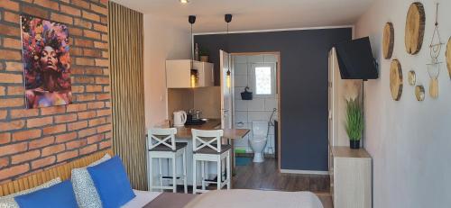 a living room with a kitchen and a dining room at NORTH in Jastrzębia Góra