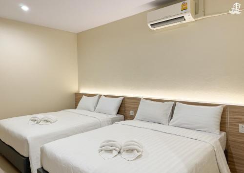 Postel nebo postele na pokoji v ubytování Jacky Chan Hotel