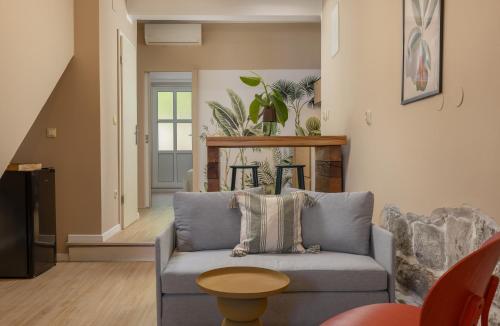 a living room with a couch and a table at Beach APARTMENT in Podgora