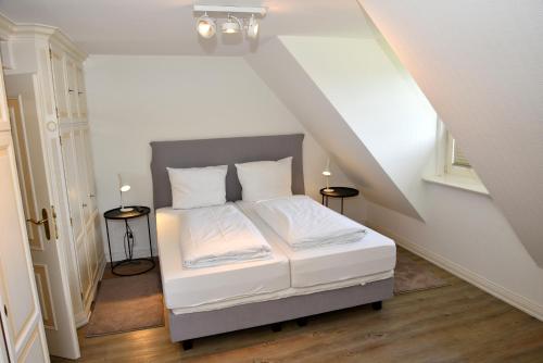 Postel nebo postele na pokoji v ubytování Haus Ameland 3e