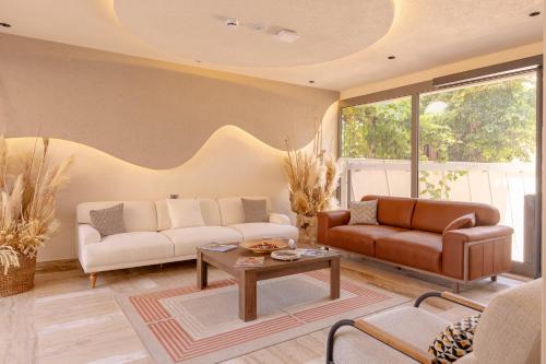 a living room with two couches and a coffee table at Los Suites in Antalya