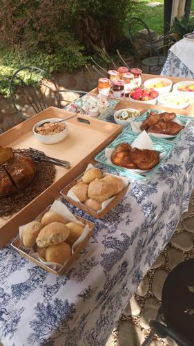 a table topped with different types of bread and pastries at Relais San Michele in Rivoli Veronese