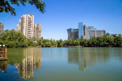 a lake in a city with tall buildings at Holiday Inn Chengdu Century City-EastTower in Chengdu
