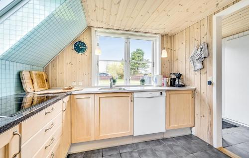 a kitchen with a sink and a window at Pet Friendly Home In Humble With Sauna in Humble