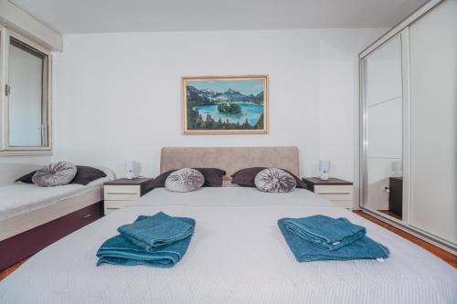 Posteľ alebo postele v izbe v ubytovaní Apartman LARA