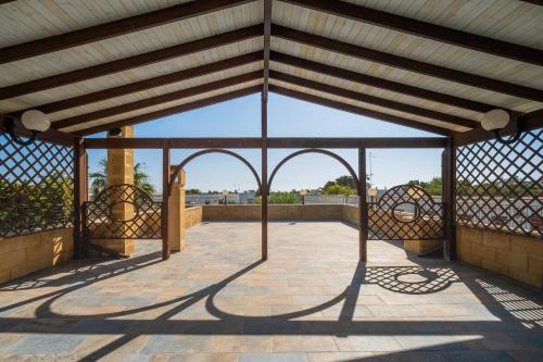 a view from the roof of a building with a fence at I Love Baia Verde spa in Baia Verde