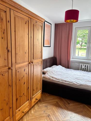 Posteľ alebo postele v izbe v ubytovaní Apartament centrum Szczytno Mazury