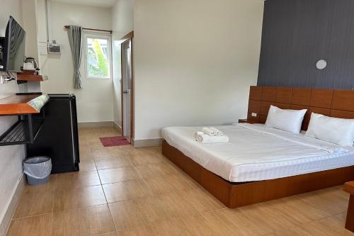Postel nebo postele na pokoji v ubytování The White House P&N Hotel Chiang Rai