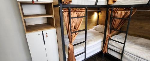 a couple of bunk beds in a room at Old City Guesthouse and Tour Ulaanbaatar Hostel in Ulaanbaatar