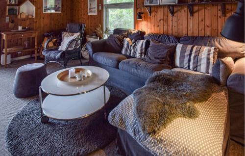 a living room with a couch and a table at Holiday Home Piledybet Humble Xi in Humble