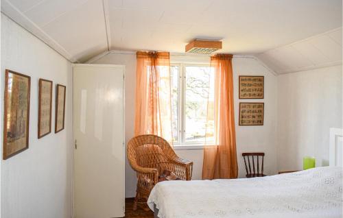 a bedroom with a bed and a window at Gorgeous Home In Burseryd With Kitchen in Sjötofta