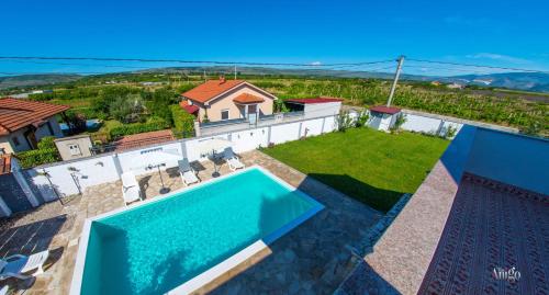 an aerial view of a villa with a swimming pool at Villa Pearl- with private pool in Blagaj