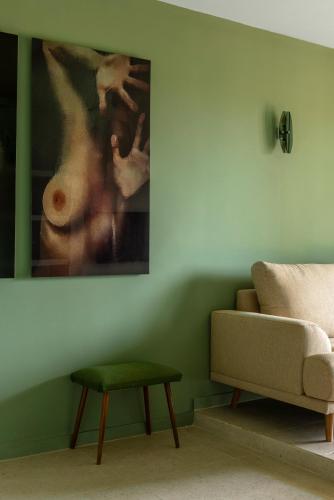 a living room with a couch and a table at MalaQuita Hotel Boutique in Santa Eularia des Riu