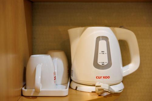 a white appliance sitting on top of a counter at Jeju Robero in Jeju