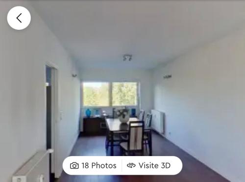 a room with a table and a dining room at Chambres à loyers dans un Penthause in Bourg-la-Reine