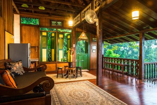a living room with a couch and a table at The Dusun in Seremban