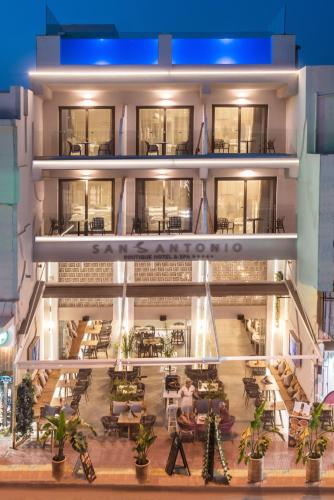 a large building with tables and chairs in front of it at San Antonio Boutique Hotel & Spa - Adults Only in Hersonissos