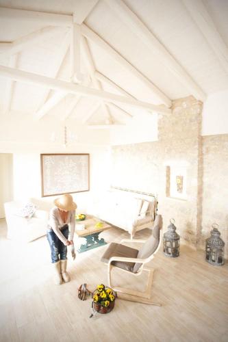 a young boy in a living room with a chair at Poliana Estate Villas in Riglia