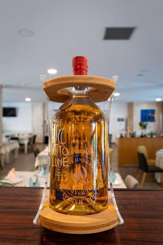 a bottle of honey sitting on top of a table at Acros Resort in Vlorë