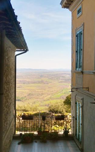 a view from the balcony of a building with a view at La Casetta del Borgo in Civitella in Val di Chiana