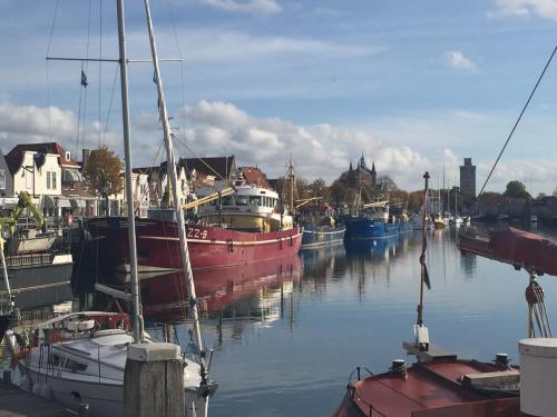 a group of boats are docked in a harbor at Zierikzee Appartement ZZ 41 at the Waterfront in Zierikzee