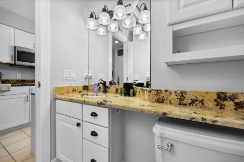 a bathroom with a sink and a mirror at The Shores in Williamsburg