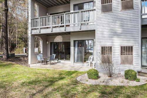 a house with a deck and a patio at The Shores in Williamsburg