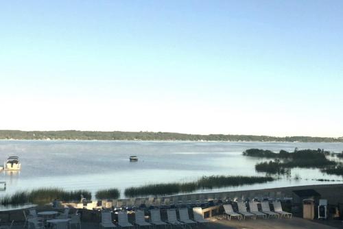 a view of a large body of water with chairs at The Shores in Williamsburg