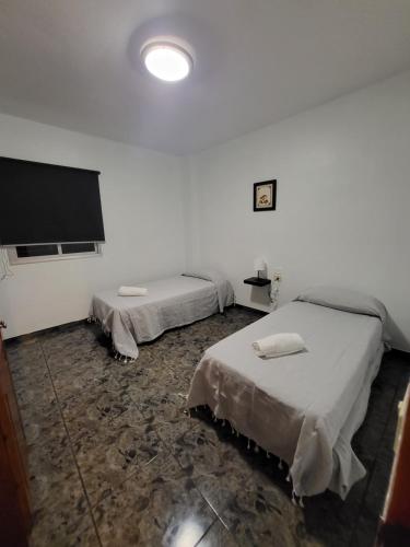 Postel nebo postele na pokoji v ubytování Casa Sara 1