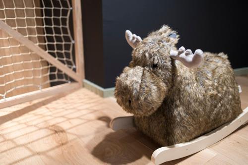 a stuffed animal is sitting in a trap at Wood (Forestia) in Theux