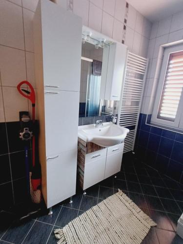 a bathroom with a sink and a mirror at 16 Čižići in Čižići