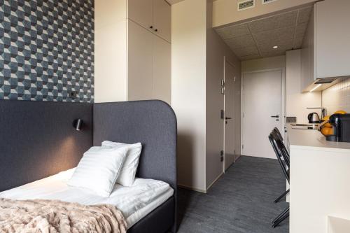 Kuchyň nebo kuchyňský kout v ubytování Hugo Apartment Hotel
