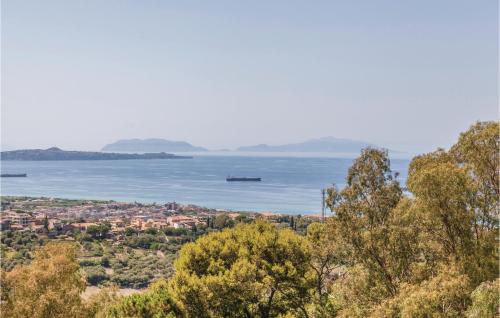 a view of a city and the water at Castello Mortellito in Spadafora