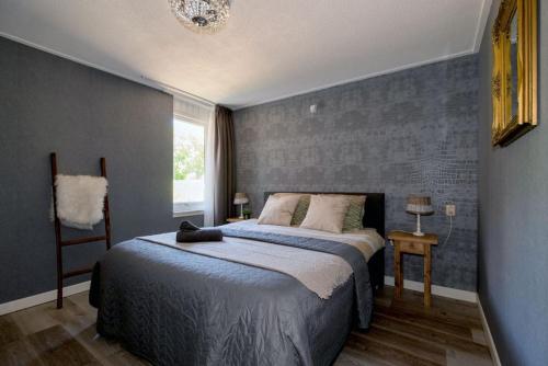 Postel nebo postele na pokoji v ubytování B & B Het Veurhuus