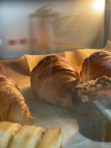 a group of croissants sitting on top of a table at Butera Apartments Luxury in Palermo