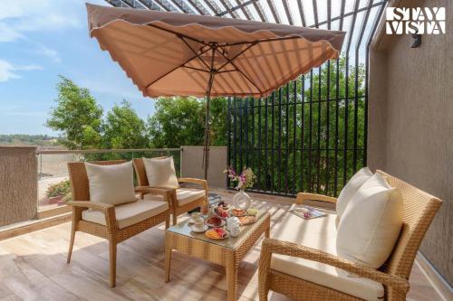 Balkón nebo terasa v ubytování Sunlit Splendour by StayVista near Nagaon beach boasting an Outdoor pool and Modern chic interiors