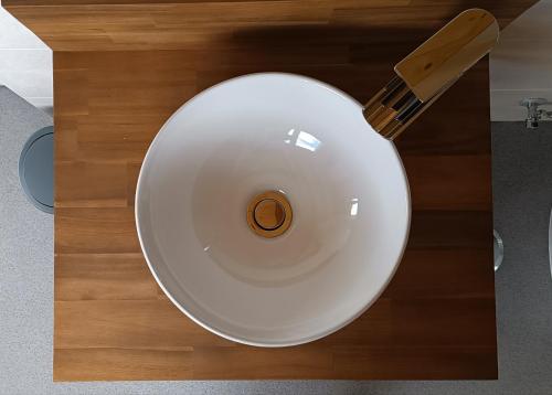 a white plate with a knife on a table at Gredos Estelar in Navatalgordo