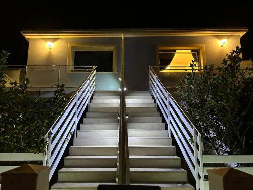 a set of stairs leading to a house at night at Le Terrazze della Dolce Casa - Blue Wave - Casa Vacanza a Marina di Ragusa in Marina di Ragusa