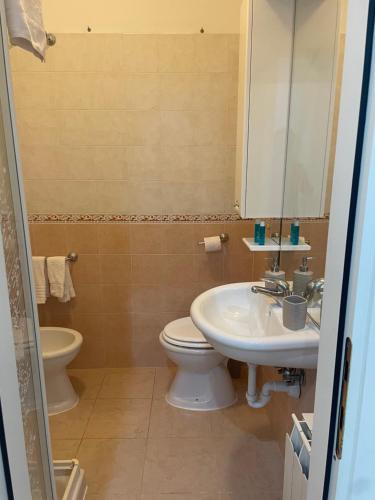 a bathroom with a toilet and a sink at Alcione113 Apartment in Francavilla al Mare