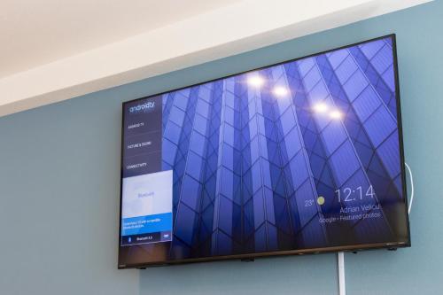 Una televisión o centro de entretenimiento en Lake Toya BLDG 2F-3F レイクトーヤビルディング 2F-3F
