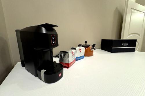 a coffee maker sitting on top of a counter at La Maison Du Relaxment in Foggia