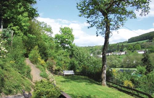 a bench sitting on the side of a hill at Holiday Home Burg-Reuland With Sauna Iv in Burg-Reuland