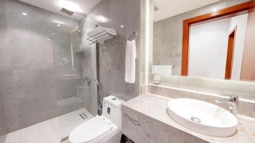 a bathroom with a sink and a toilet and a shower at Al Masem Serviced Apartments - Al Olaya - Exit 5 in Riyadh
